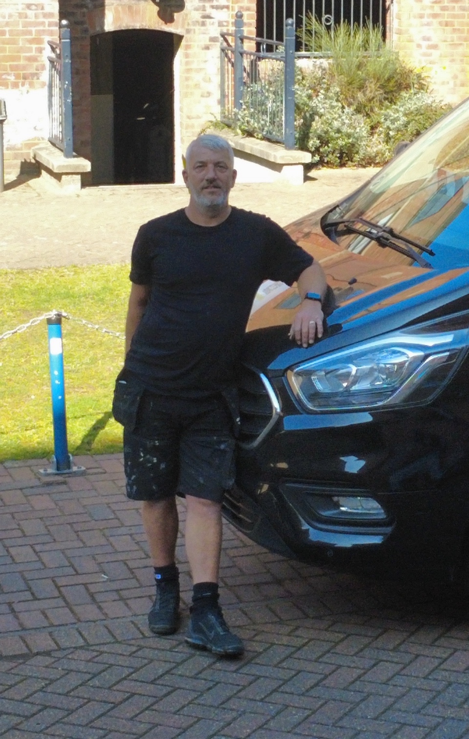 James Briley beside a van