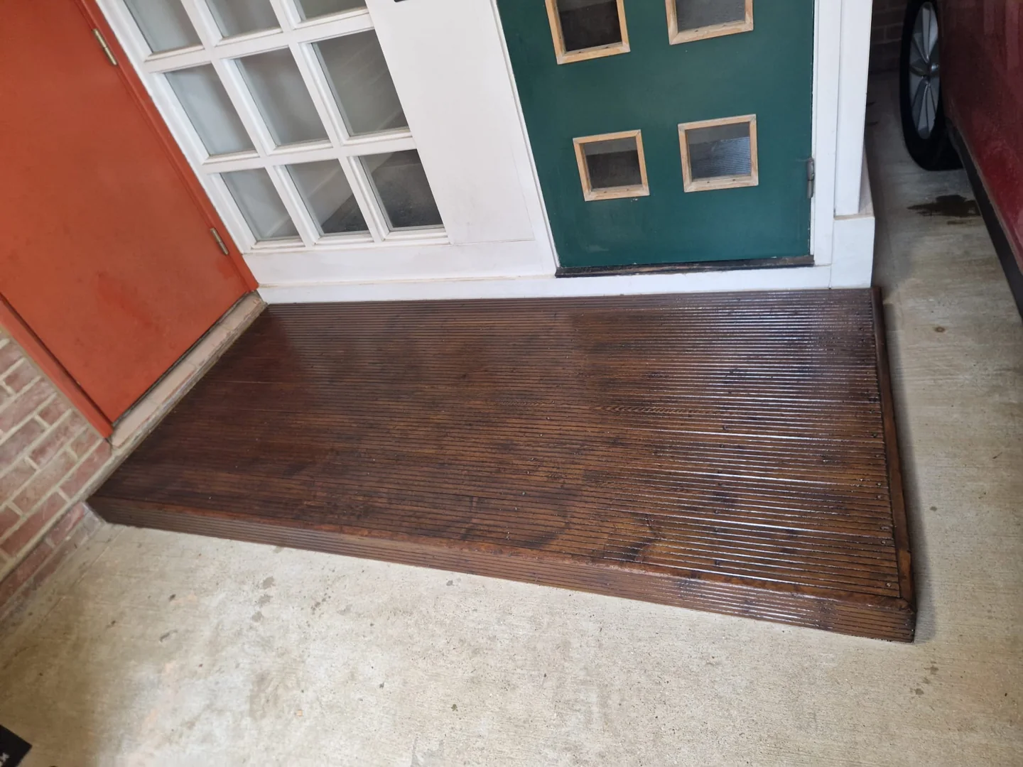 The finished timber platform beside the communal entrance.