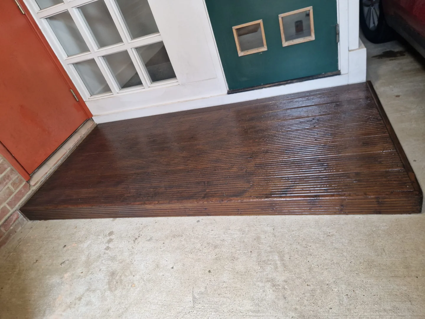 Completed woodstained decking viewed from the front.