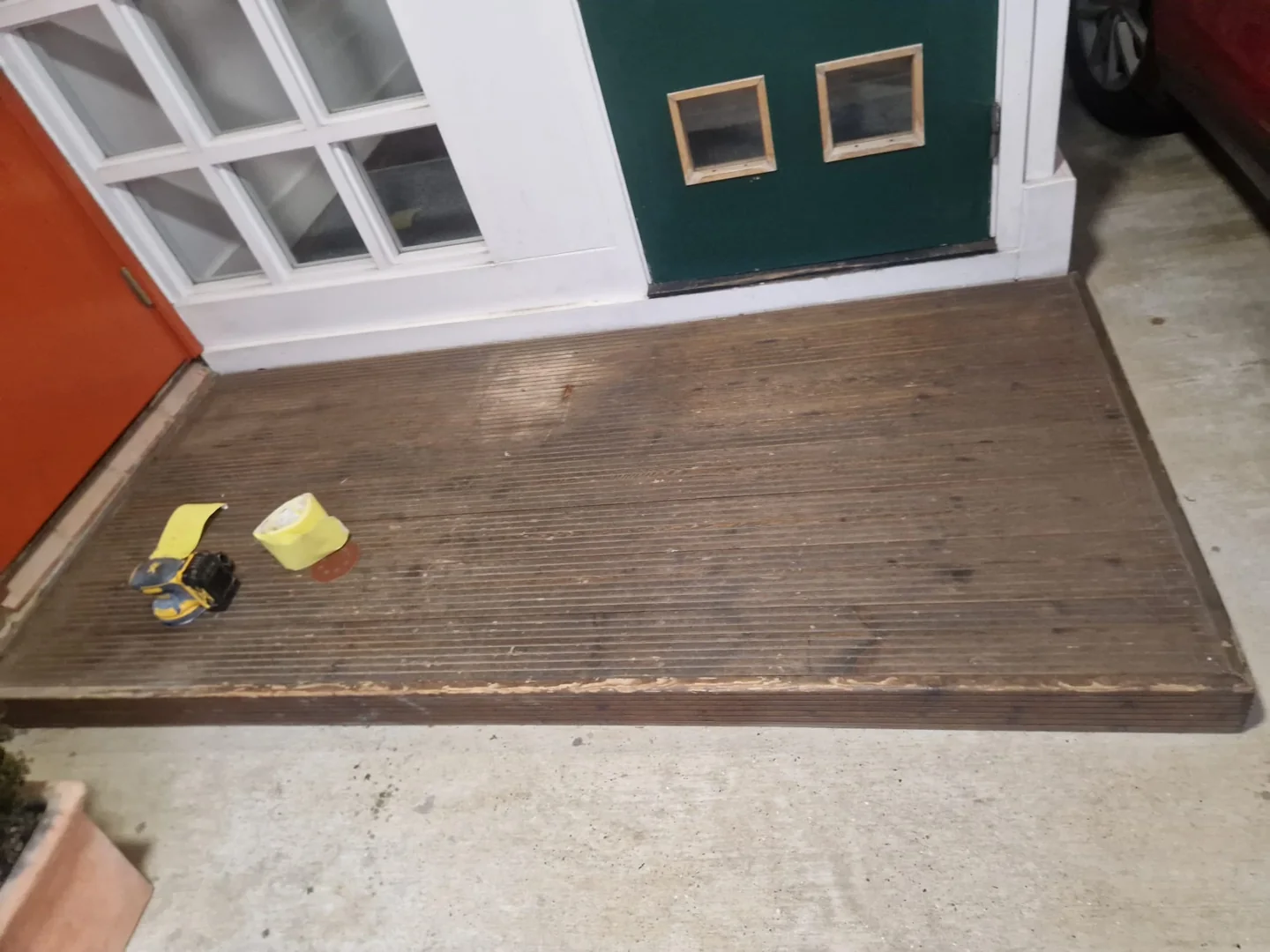 Sanding and preparation of the existing timber surface.