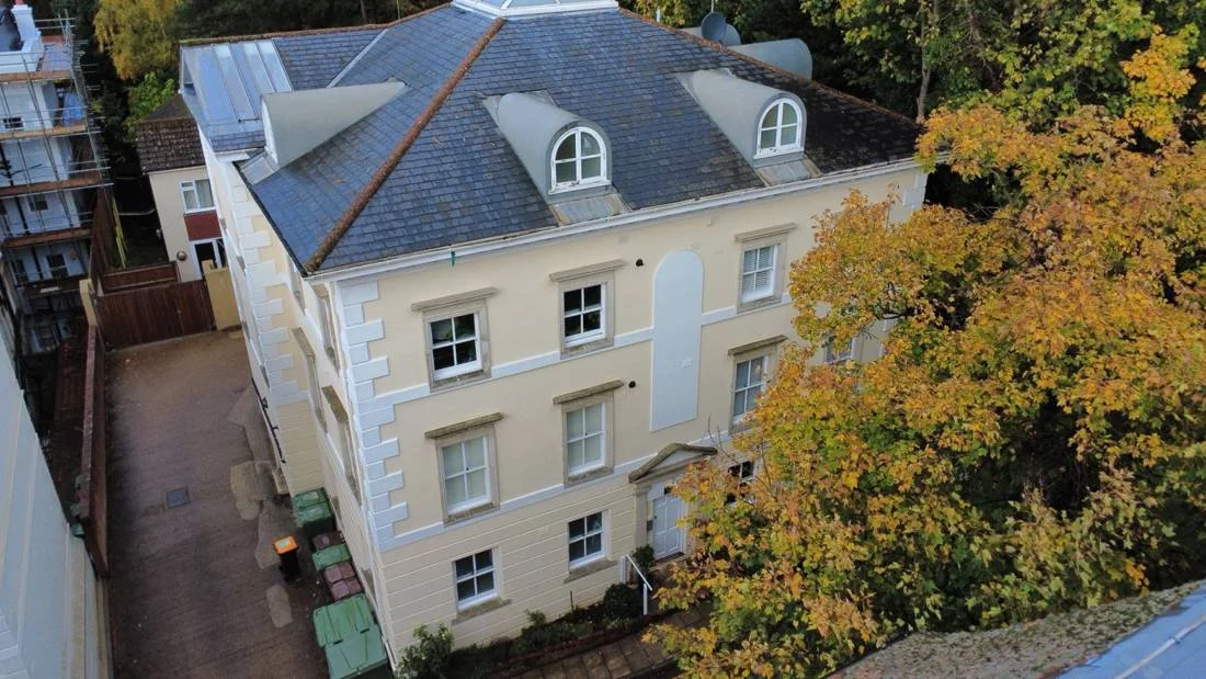A coordinated timber-window inspection across nine flats, supported by internal photographs, drone views and condition schedules.